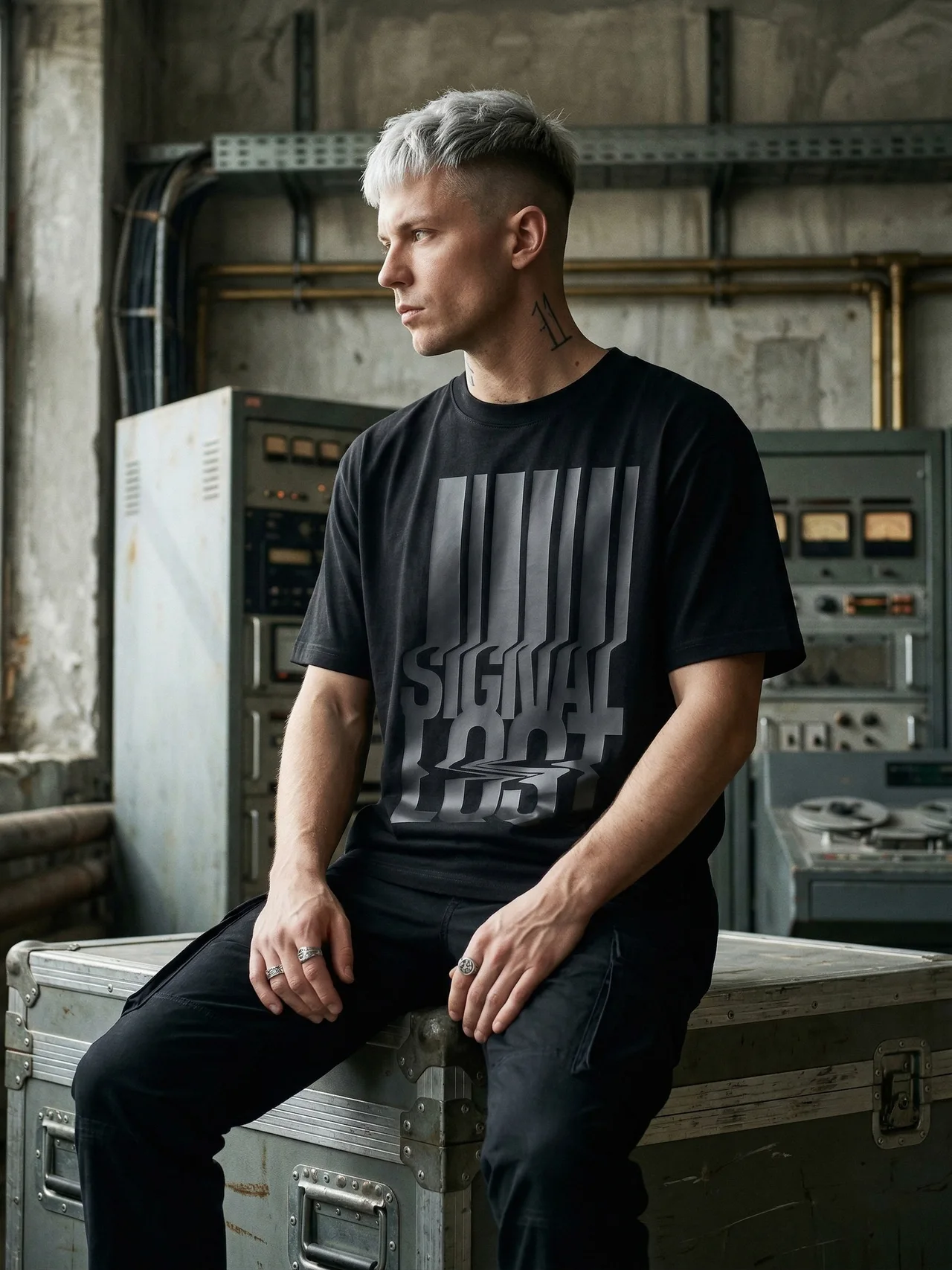 Signal Lost T-shirt worn among industrial audio equipment